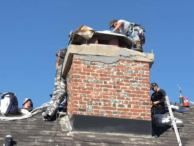 Westport Chimney Sweep installing a custom chimney crown in Westport, CT