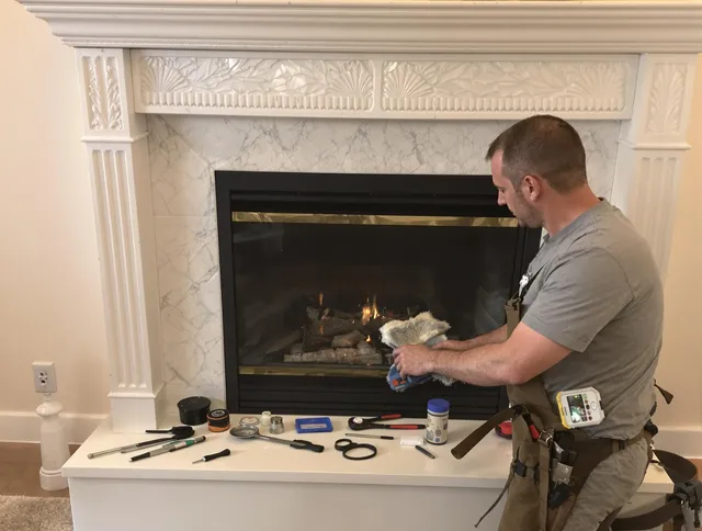 Westport Chimney Sweep performing fireplace maintenance in Westport, CT