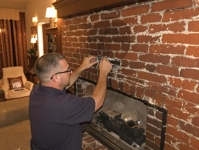 Westport Chimney Sweep expert fixing a fireplace in Westport, CT